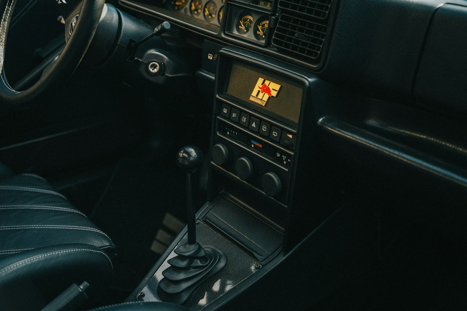 a dashboard of a car with a steering wheel